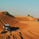 4x4 vehicles in the desert on an evening safari