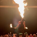 Fire show performer at night