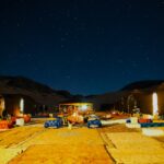 Outdoor beds under a starry night sky