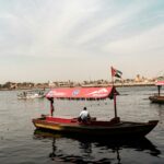 Traditional abra boat with a UAE flag on Dubai Creek
