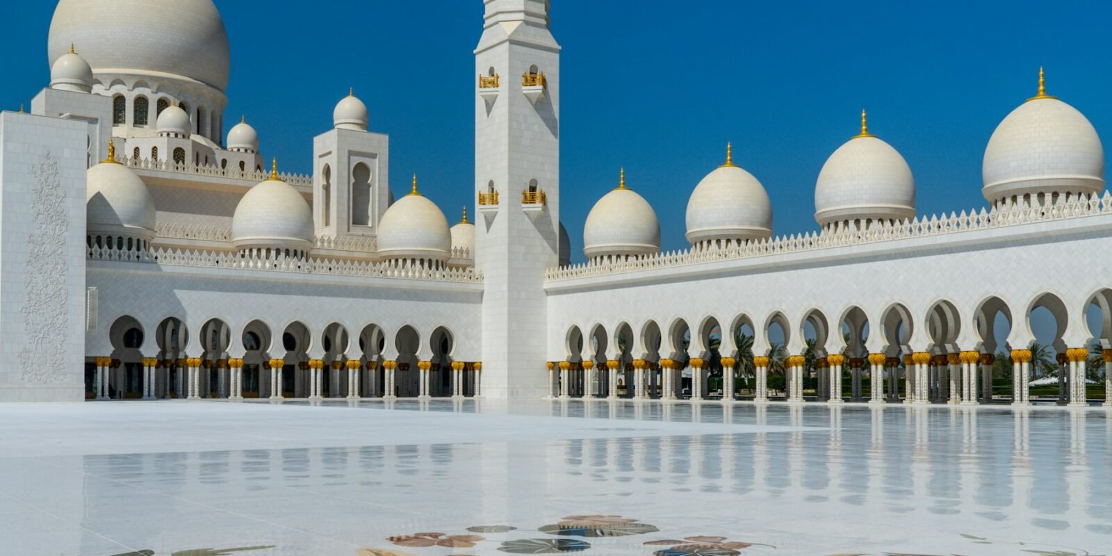 White domes and minaret of the Sheikh Zayed Grand Mosque
